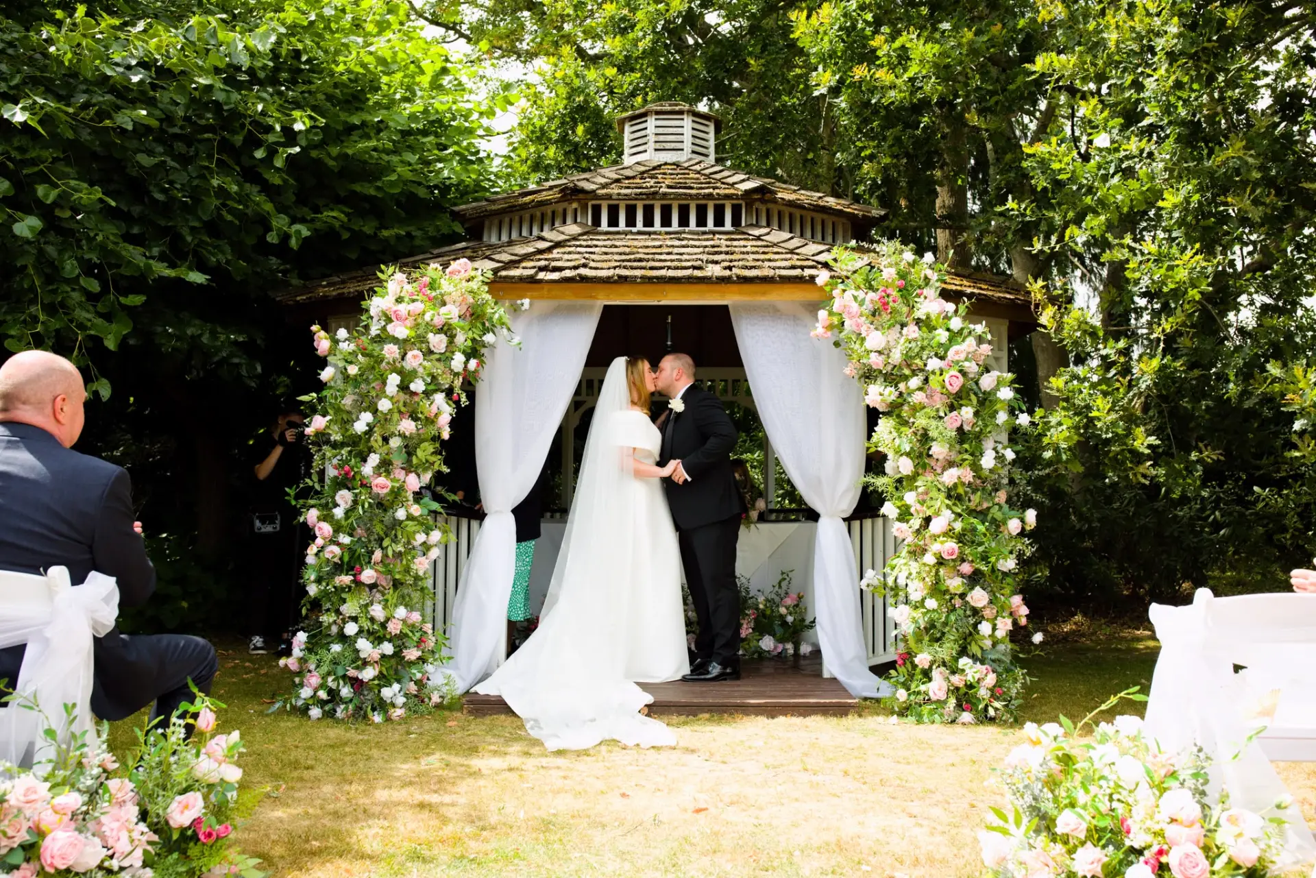 Mr and Mrs Vearer's ceremony under a floral-draped gazebo, styled by Laye's