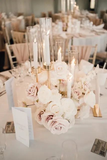 Candlelit centrepiece with blush roses